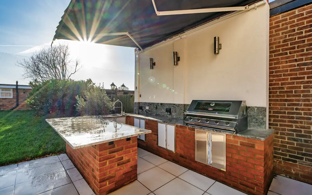 Outdoor kitchen beside the completed Ealing Common garden building